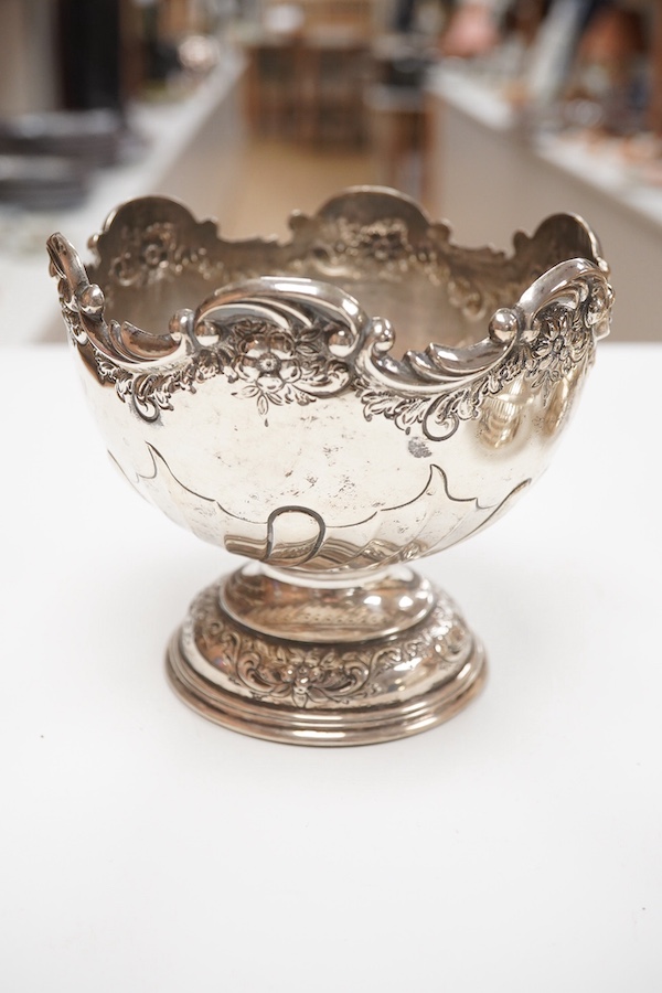 A George III small silver sugar basket, London, 1810, with blue glass liner, 57mm, a George III silver sifter spoon, a pair of silver bonbon dishes and an Edwardian small rose bowl, 16.9oz. Condition - poor to fair to go